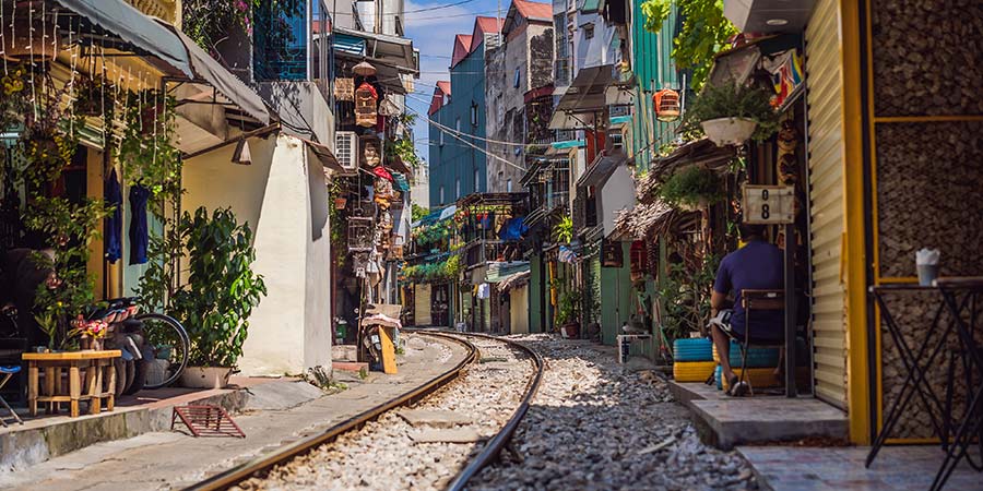 The iconic train street of Hanoi – the train tracks run straight through a narrow street with open shops on either side.